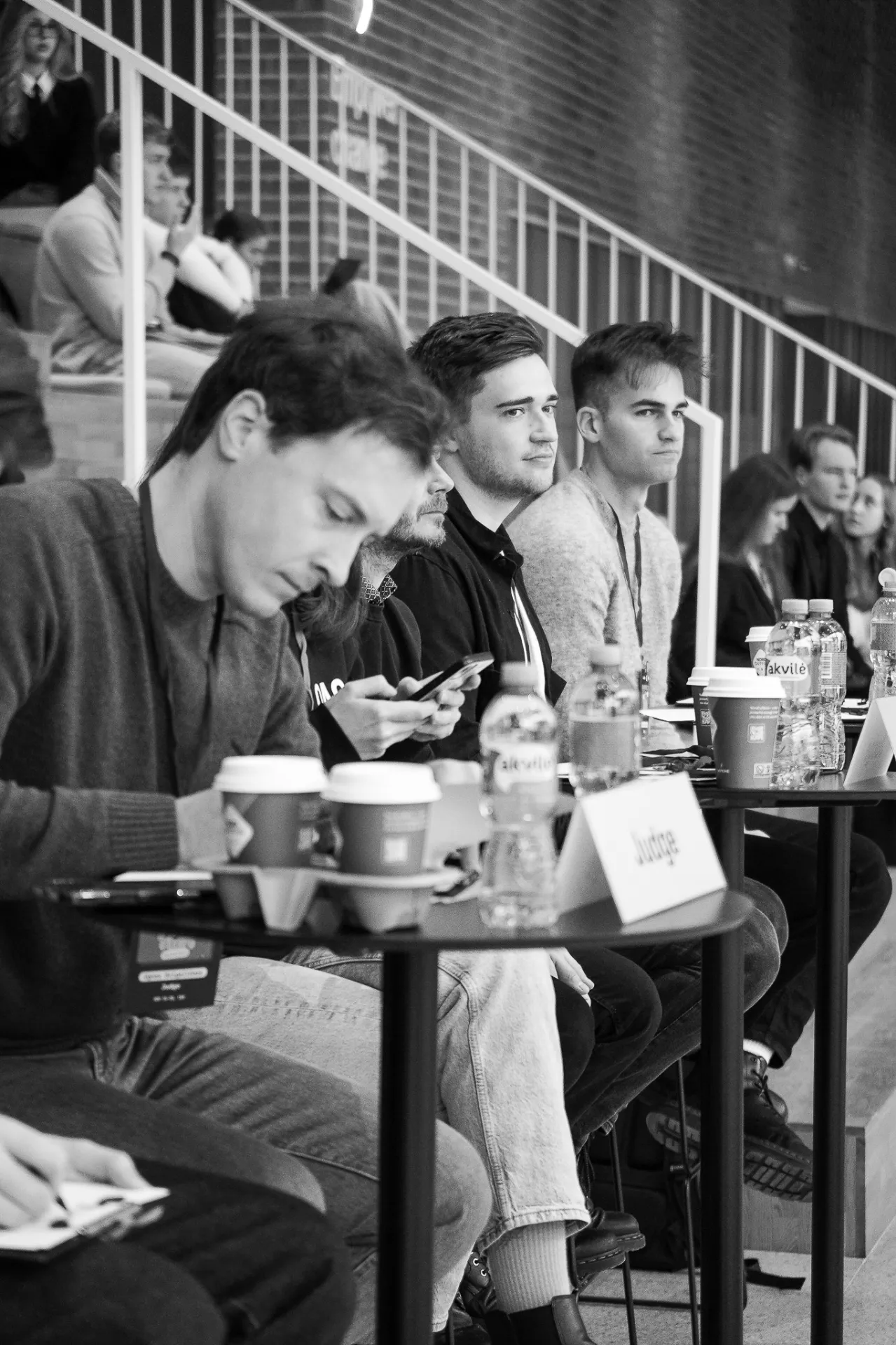 Judges evaluating pitches at the hackathon